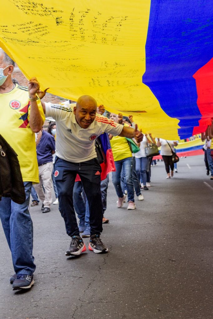 People During Demonstration with Colombia Flag
